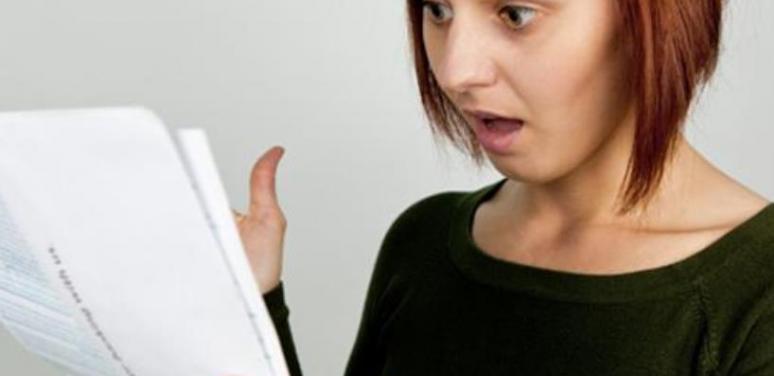 Woman surprised at getting a document.